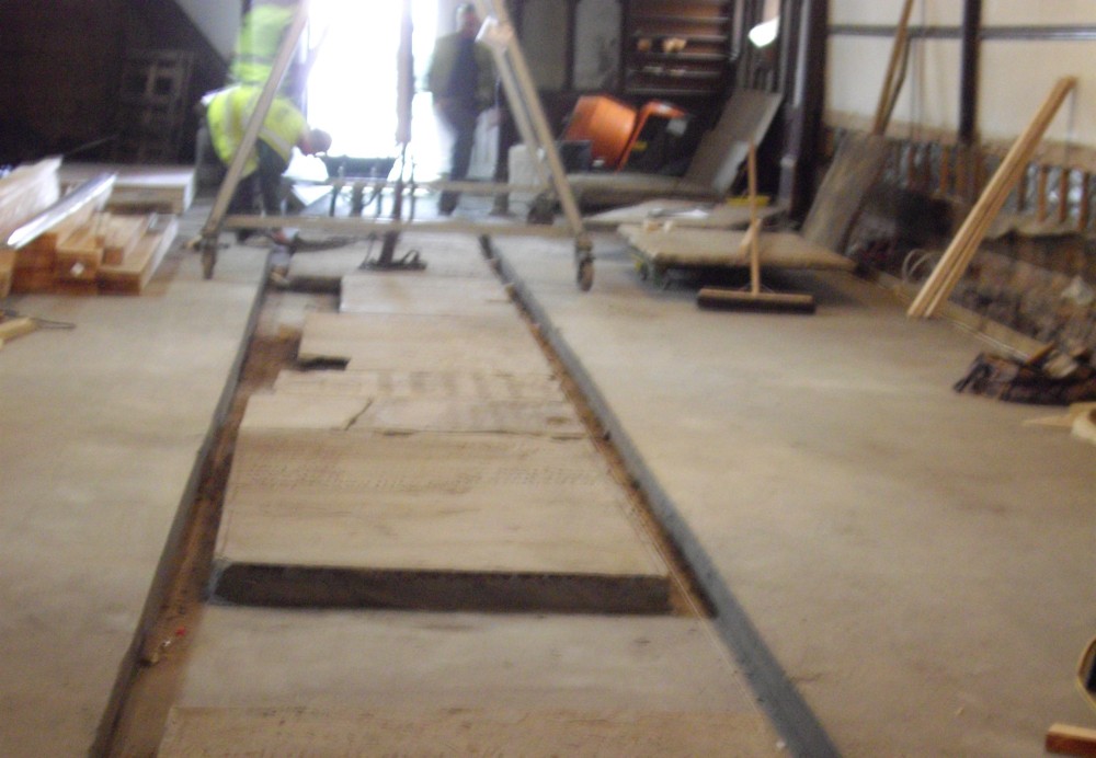 Memorial stones being set in the aisle