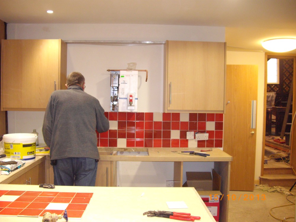 Servery tiles being applied